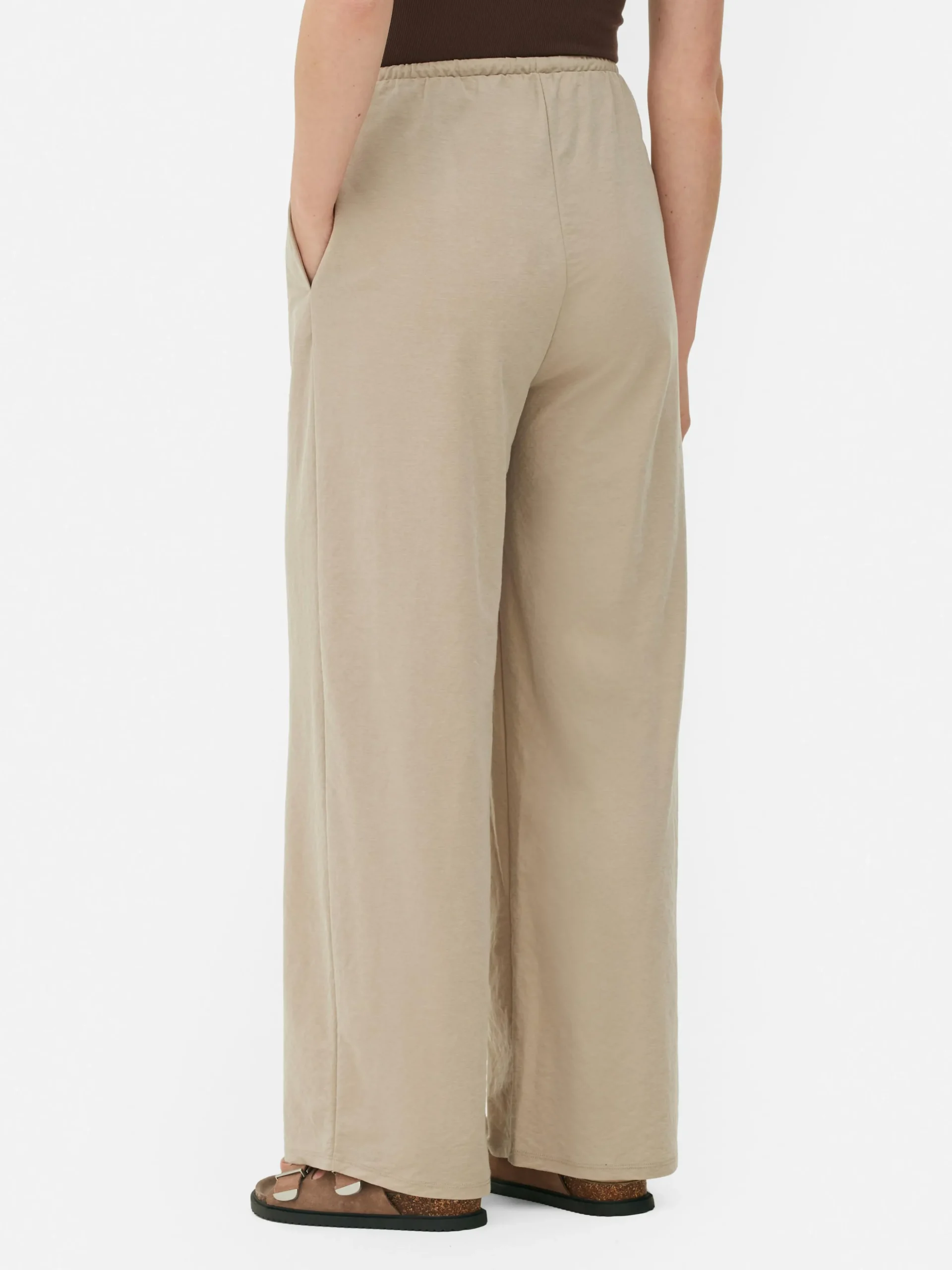 Calças Cordão Corte Perna Direita