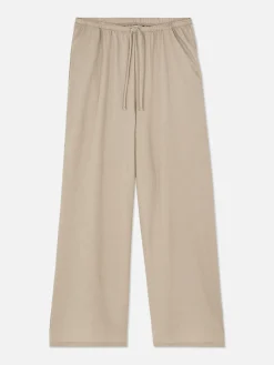 Calças Cordão Corte Perna Direita