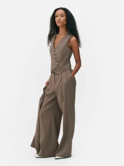 Colete Corte Assimétrico Botão Frente